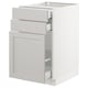White kitchen cabinet with grey drawers and door, rectangular design.