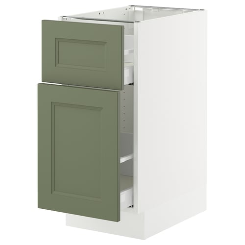 Green kitchen cabinet with white interior, rectangular doors, and integrated shelves. Modern design with seamless structure.