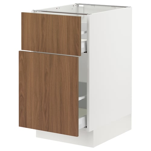 A modern kitchen cabinet, named SEKTION, sleek white and wood-grain doors, housing multiple shelves for storage.
