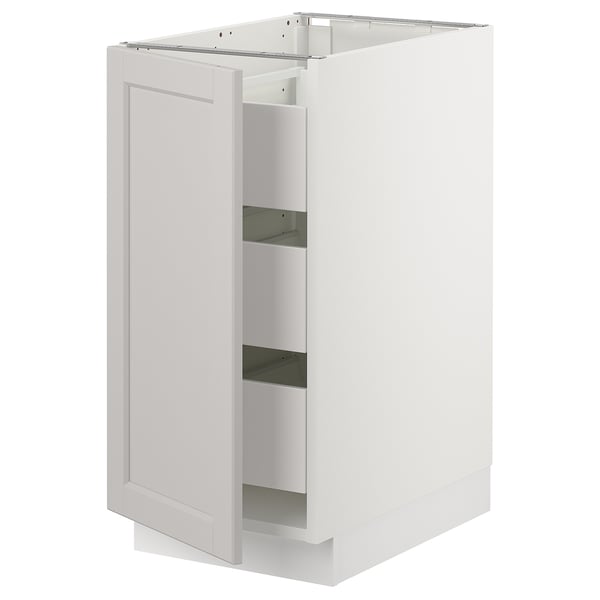 White SEKTION kitchen cabinet with one open door, smooth design, bevelled edges, solid birch frame, and full-extension drawer.