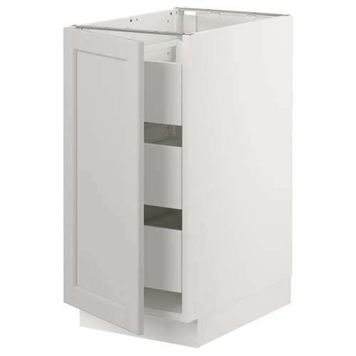 White SEKTION kitchen cabinet with one open door, smooth design, bevelled edges, solid birch frame, and full-extension drawer.