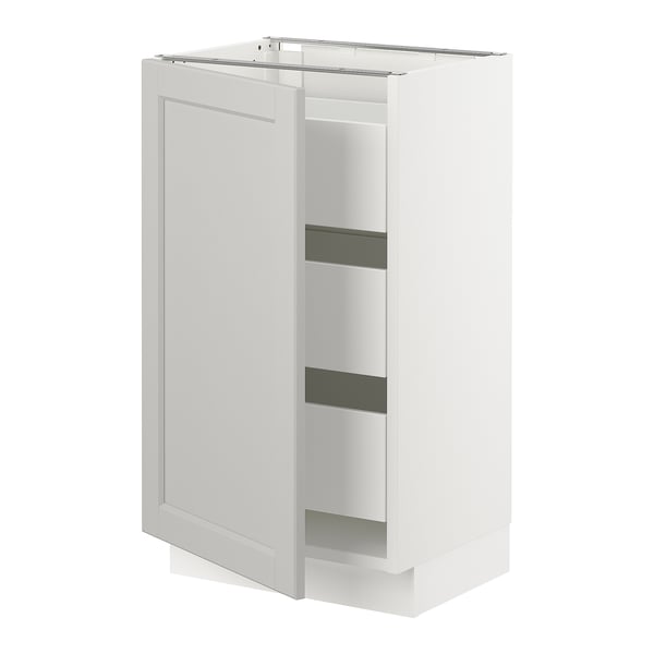 White kitchen cabinet with grey shelves and pull-out drawers.