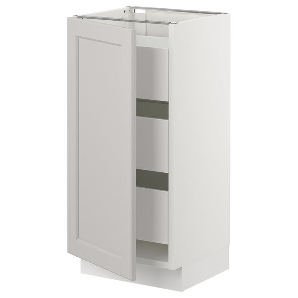 A tall white SEKTION kitchen cabinet with one open door, revealing two shelves.