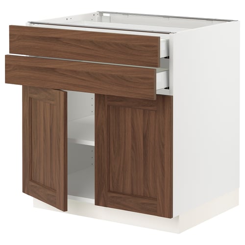 White and wooden cabinet with drawers and doors.