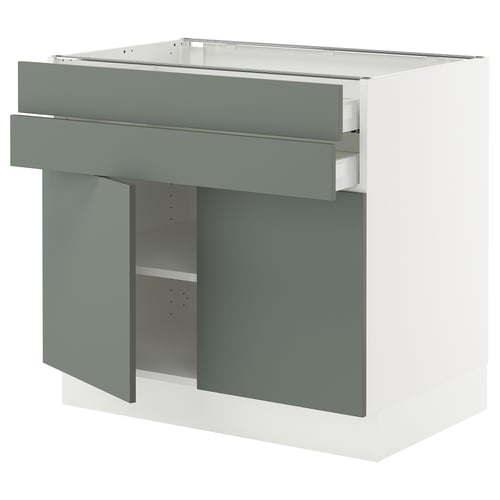 This image shows a white and green kitchen cabinet with two drawers and open shelves, featuring modern design and sturdy construction.