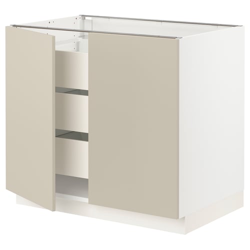 An ikea SEKTION kitchen cabinet in beige with shelves and a white base.