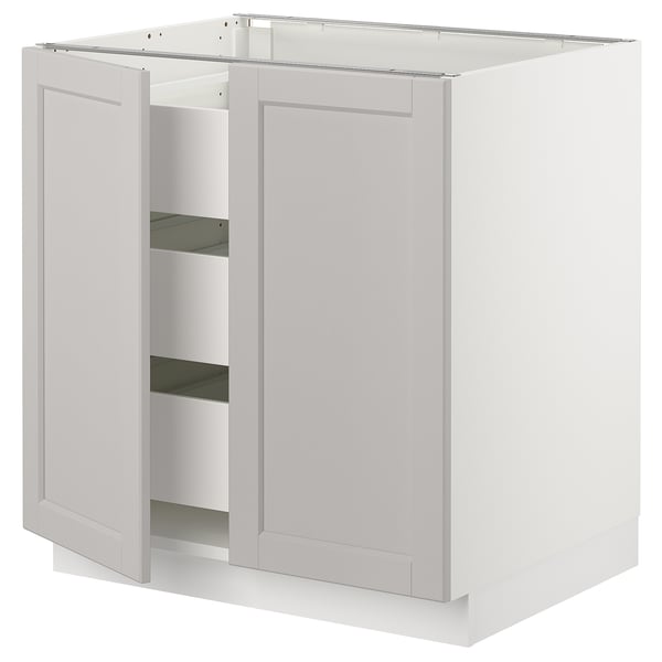 White kitchen cabinet with light grey doors and shelves. Traditional look, bevelled edges.