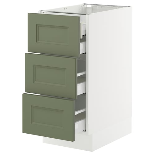 A white IKEA SEKTION kitchen cabinet with three green drawers. The drawers are flat-fronted with gray-green colour and have a smooth, modern design.