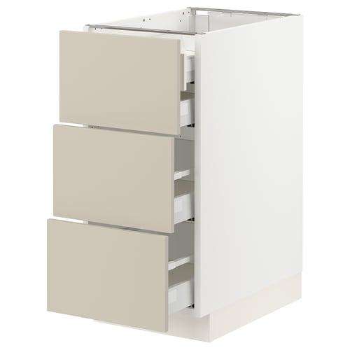 An ikea SEKTION kitchen cabinet with beige havstorp drawer fronts. Its a modern design with three full-extension drawers.