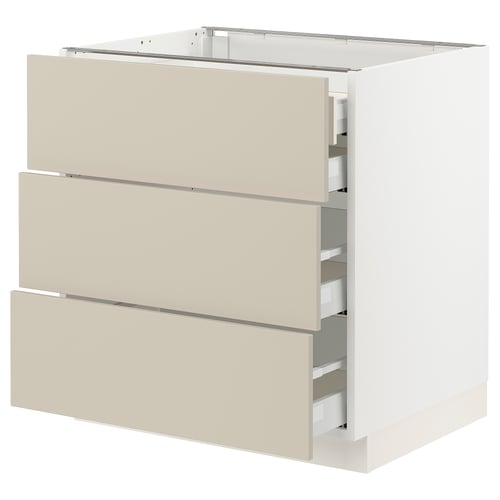 An ikea SEKTION kitchen cabinet in beige with smooth, flat doors and three drawers. Its a base unit with a white frame and soft-close drawers.