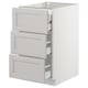 A white SEKTION kitchen base cabinet with three lerhyttan light grey drawers featuring bevelled edges.
