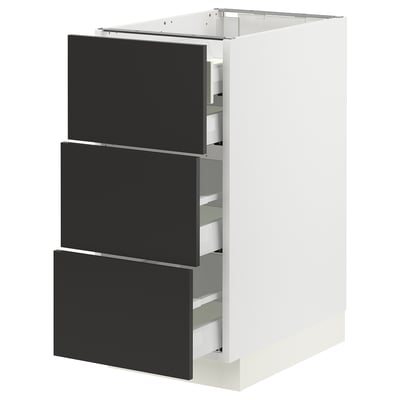 Modern white kitchen cabinet with three black drawers, sleek design.