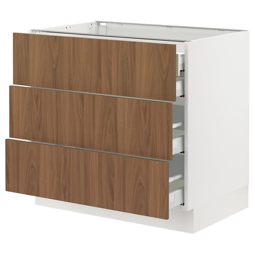 Modern white SEKTION kitchen cabinet with wooden drawers in walnut finish and soft-close full-extension drawers.