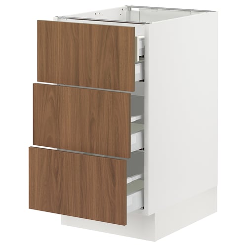 Modern white kitchen cabinet with three wooden drawers, sleek handles, and smooth finish.