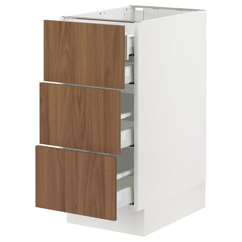 White kitchen cabinet with three walnut drawers, modern design.