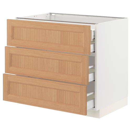 A modern SEKTION kitchen cabinet with three natural oak drawers and soft-close drawers.