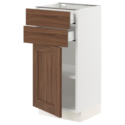 A white SEKTION kitchen cabinet with walnut drawers. It two drawers and one door, displaying a modern design.