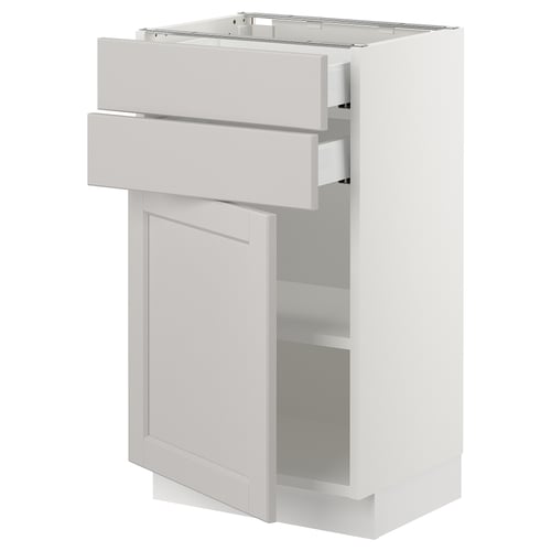 White SEKTION kitchen unit with light grey drawers and door, bevelled edges.