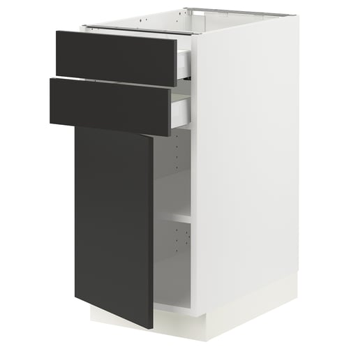 Modern white kitchen cabinet with black drawers and door.