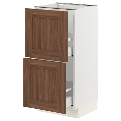 A white SEKTION kitchen cabinet with wooden brown doors and shelves.