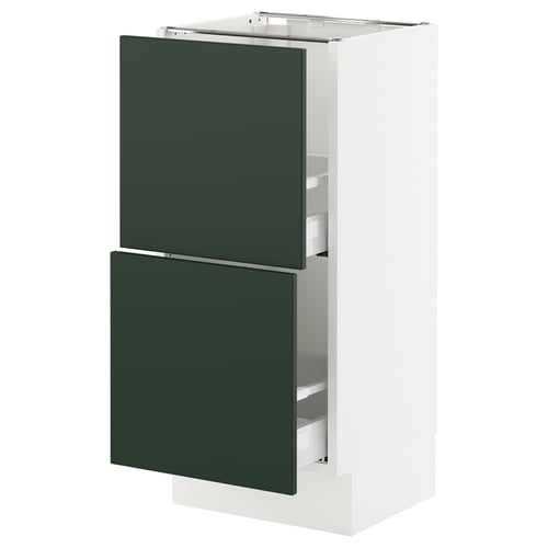 A modern, tall kitchen cabinet with two dark green drawers and a white frame, part of the SEKTION system.