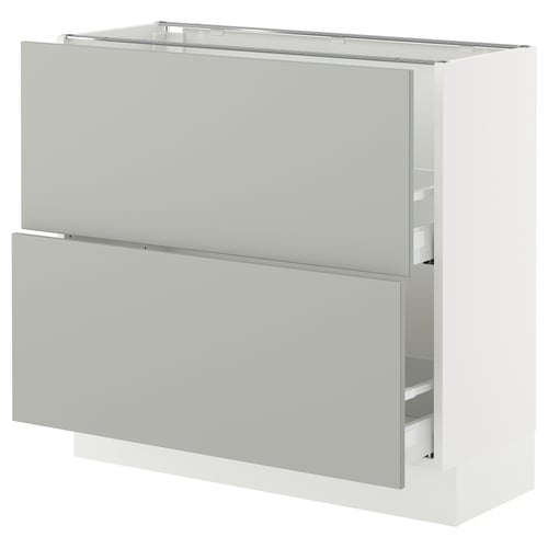 Modern white SEKTION kitchen cabinet with grey fronts, two drawers, and upper shelf.