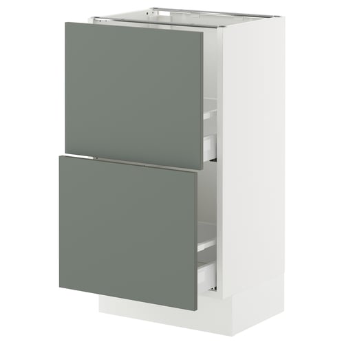 The SEKTION kitchen cabinet from IKEA. It has two grey-green pull-out drawers and is primarily white, providing a modern and sleek appearance.