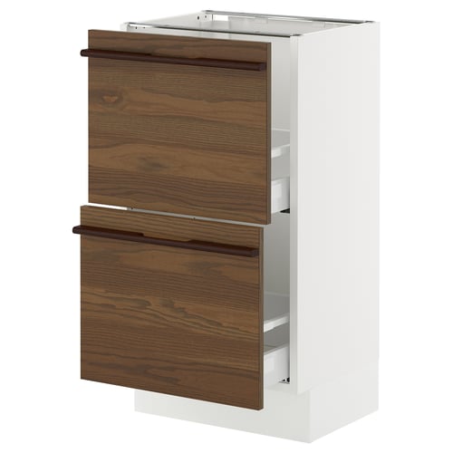 An ikea SEKTION kitchen cabinet with dark brown ash veneer drawers and white frame, featuring solid wood handles and full-extension drawers.