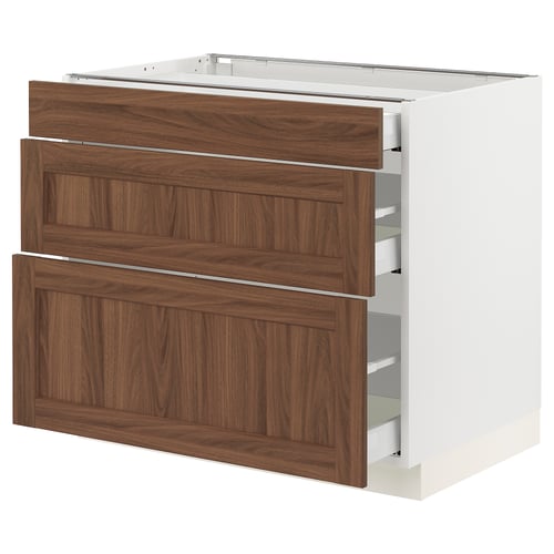 An ikea SEKTION kitchen unit with three walnut-colored drawers. Its white with wooden fronts and smooth-running drawers.