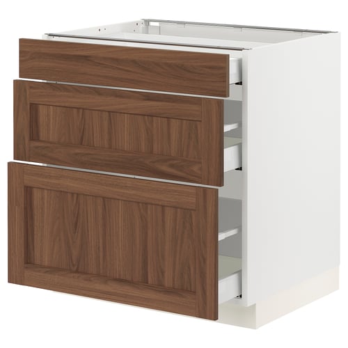 White kitchen cabinet with walnut drawers and panels, modern design.