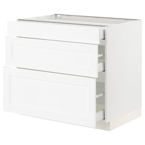 White SEKTION kitchen cabinet with wooden grain texture.