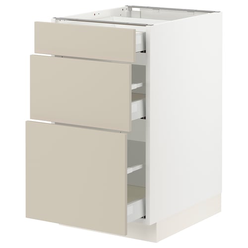 Modern kitchen cabinet with beige drawers, featuring sleek, smooth surfaces and full-extension drawers.