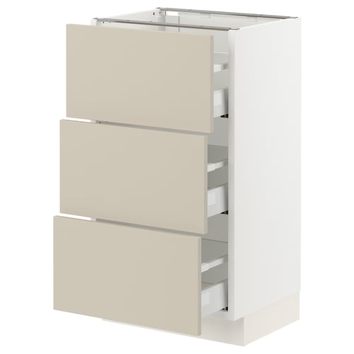 An ikea SEKTION kitchen cabinet with beige havstorp drawer fronts. It three drawers with a smooth, minimalist design and a white frame.