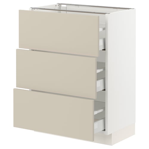 SEKTION white kitchen cabinet with three beige drawers.