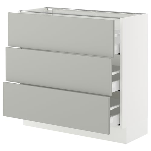 A white SEKTION kitchen cabinet with three drawers in light grey. Its modern and rectangular.