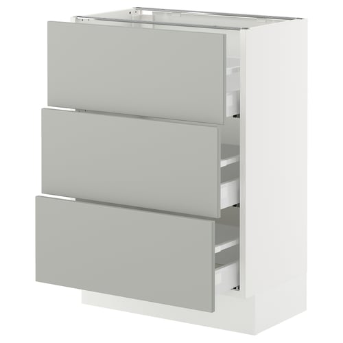 White kitchen cabinet with three grey drawers.