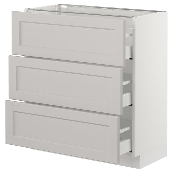 A white SEKTION kitchen cabinet with three pull-out drawers, offering a traditional design with bevelled edges.