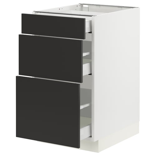 An ikea SEKTION white kitchen cabinet with three black drawers.