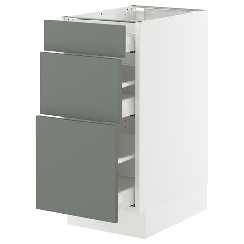 The SEKTION kitchen cabinet three greenish-gray drawers on a white base, offering modern and harmonious storage.
