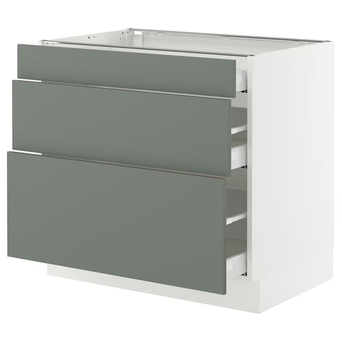 An ikea SEKTION kitchen cabinet with three grey-green drawers and a white base.