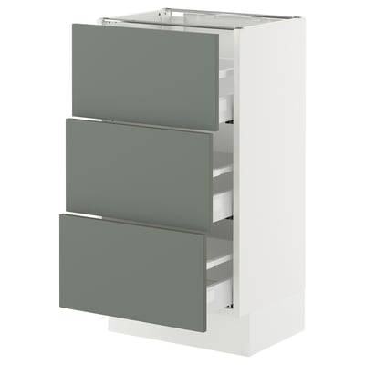 SEKTION kitchen cabinet in white with greenish-grey drawers. Modern, rectangular design. Three drawers with smooth, sleek fronts.