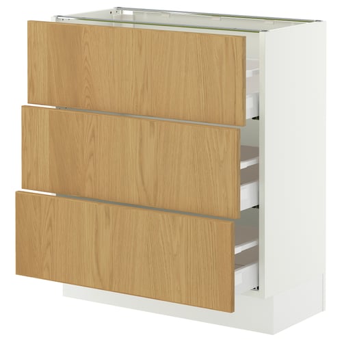 A light oak wooden cabinet with white edges, featuring three drawers and a storage area, part of the SEKTION kitchen system.