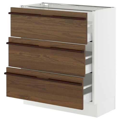 White kitchen cabinet with 3 dark wood drawers and steel handles.
