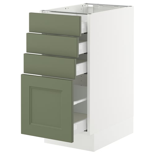 An open kitchen cabinet, featuring three green drawers and one green door in a white frame, part of the SEKTION system.