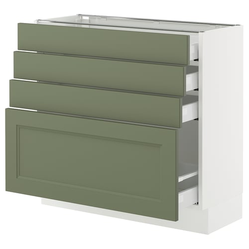 Green kitchen cabinet with drawers, modern design.