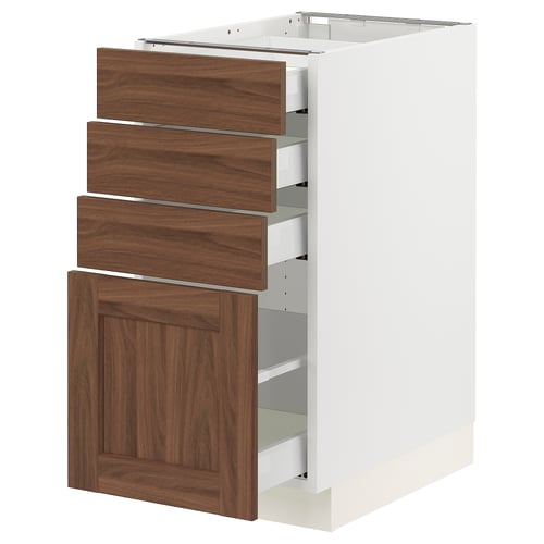 SEKTION white kitchen cabinet with walnut drawers and door.
