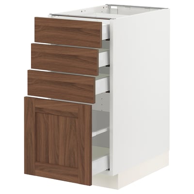 SEKTION white kitchen cabinet with walnut drawers and door.