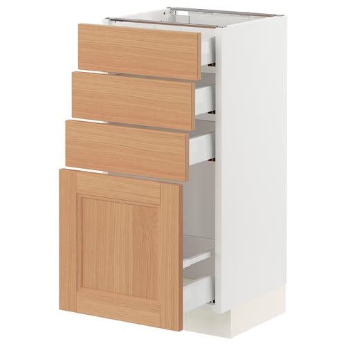An ikea SEKTION kitchen cabinet with white and oak drawers, modern design.