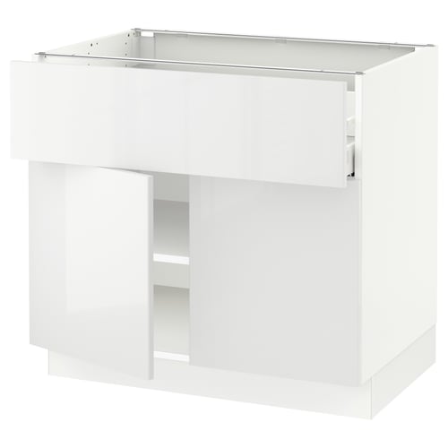 White SEKTION kitchen cabinet with glossy finish and snap-on hinges.