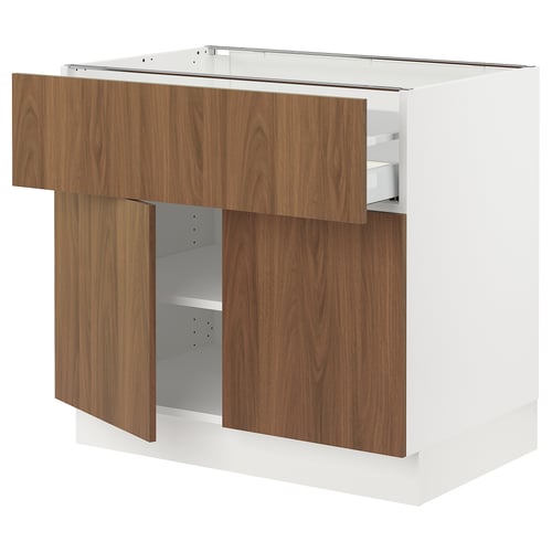 Modern white kitchen cabinet with walnut-colored drawers and door. Adjustable shelves and full-extension drawers with dampers for smooth closing.